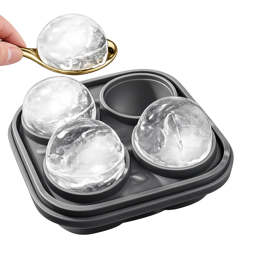 Premium whiskey ice sphere mold with spoon and large round ice balls on white background