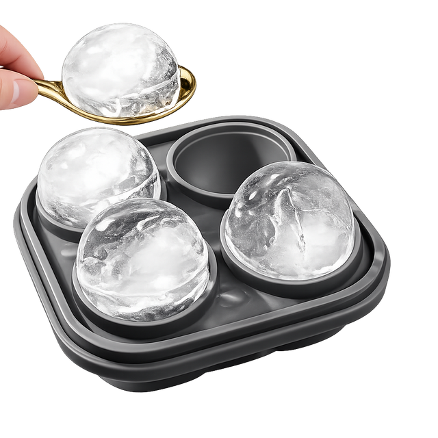 Premium whiskey ice sphere mold with spoon and large round ice balls on white background