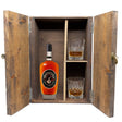 Michter's 10 Year Single Barrel Bourbon in a wooden gift box with two crystal glasses on white