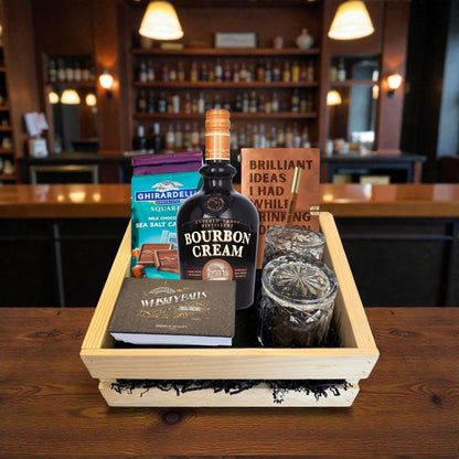 Buffalo Trace Bourbon Cream deluxe gift crate with crystal glasses, chocolates, whiskey balls, and journal inside a bar – rare bourbon liqueur gift set