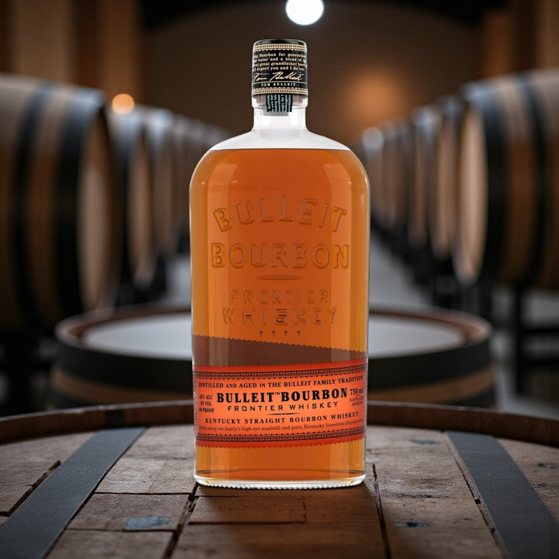 Bulleit Bourbon Frontier Whiskey 750ml engravable bottle displayed on rustic bar with warm tones – Rare Bourbon Shop lifestyle photo