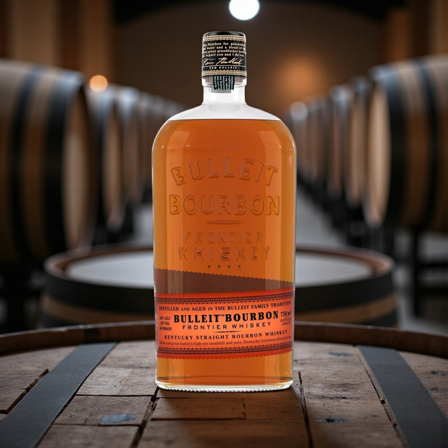 Bulleit Bourbon Frontier Whiskey 750ml engravable bottle displayed on rustic bar with warm tones – Rare Bourbon Shop lifestyle photo