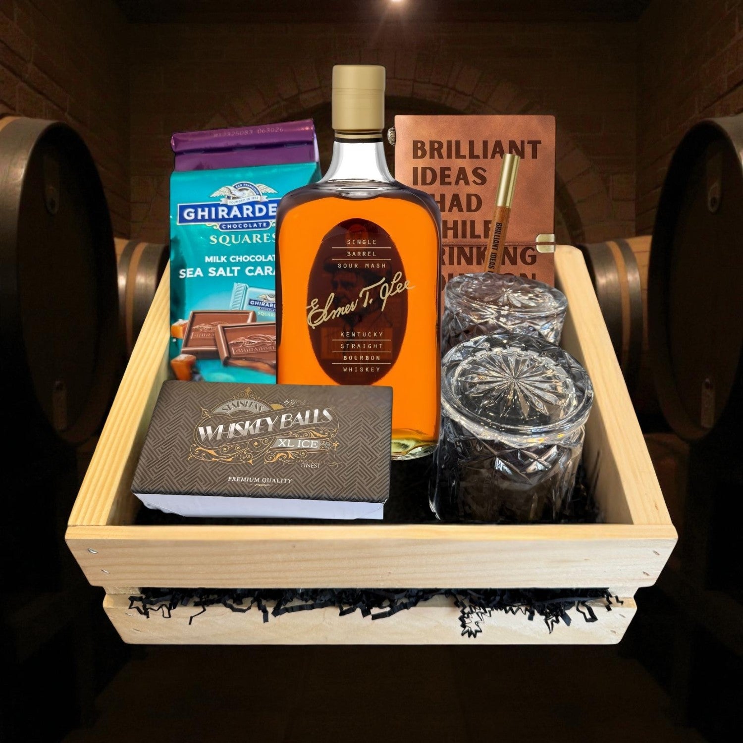 Elmer T. Lee Single Barrel Bourbon Gift Crate featuring engraved glasses, journal and chocolates arranged in a wooden crate in a bourbon cellar – limited edition gift from Rare Bourbon Shop
