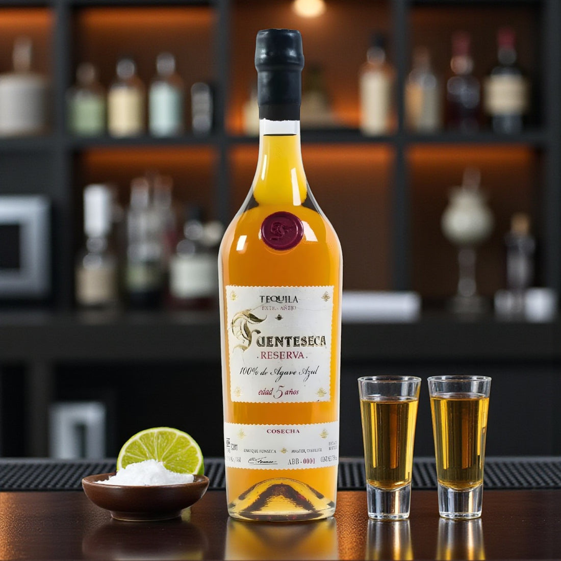 Collector’s Fuenteseca Reserva 5 Year Extra Añejo Tequila Limited Edition bottle with shot glasses, lime, and salt on bar – Rare Bourbon Shop lifestyle photo