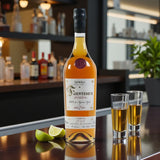 Collector’s Fuenteseca Reserva 7 Year Extra Añejo Tequila Limited Release bottle with two shot glasses and lime wedges on bar – Rare Bourbon Shop lifestyle photo