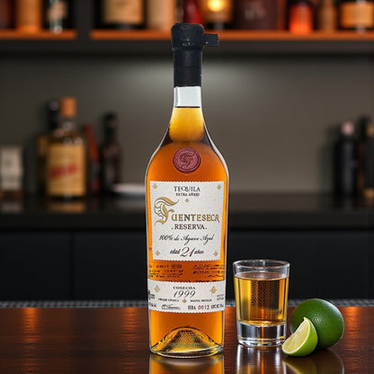 Collector’s Fuenteseca Reserva Extra Añejo 21 Year Tequila 750ml bottle with shot glass and limes on bar – Rare Bourbon Shop lifestyle photo