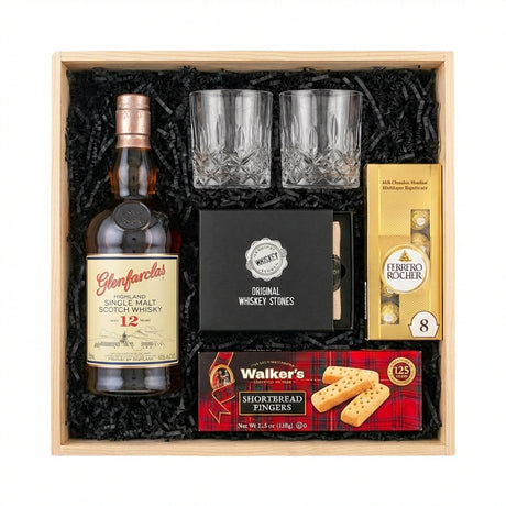 Glenfarclas 12 Year Sherry Cask Single Malt Scotch Whisky gift crate with crystal old fashioned glasses, whiskey stones, Ferrero Rocher chocolates, Walker's shortbread, and natural wood crate with black crinkle fill