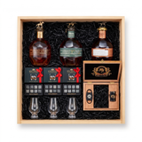 Blanton's Executive gift crate with three Blanton's bourbon editions, three Glencairn-style glasses, three whiskey stones sets, and a hand-finished wooden accessory box with a cutter and lighter, nested in a natural wood crate.