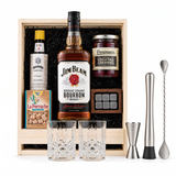 Jim Beam Old-Fashioned gift crate: Jim Beam Kentucky Straight Bourbon 750ml, two old-fashioned glasses, Angostura bitters, La Perruche sugar cubes, Peninsula cocktail cherries, whiskey stones and bar tools in a wooden crate on white.